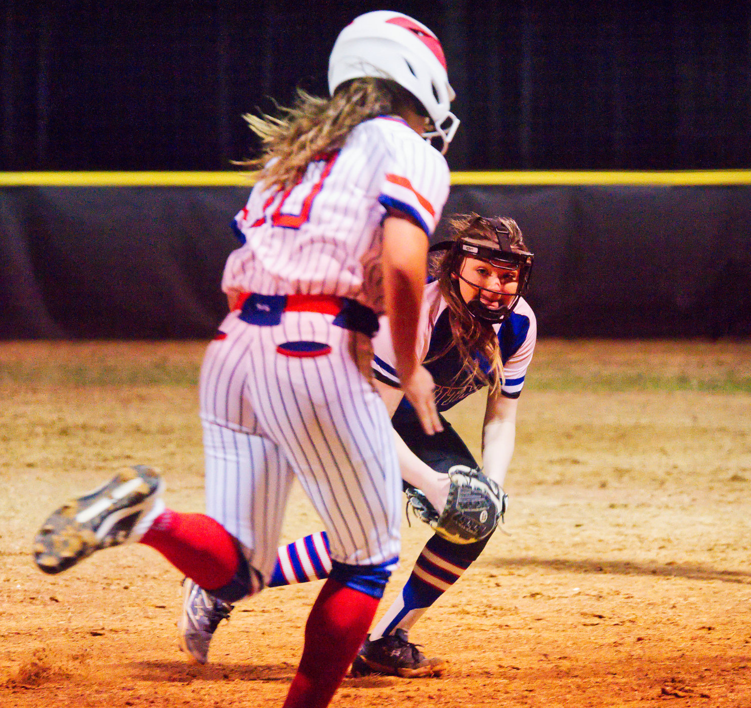 Alexis O’Neal of Quitman puts the tag on Erin Langston of Alba-Golden on a grounder in last week’s intra-county softball match-up. [pitcher pictures & more]